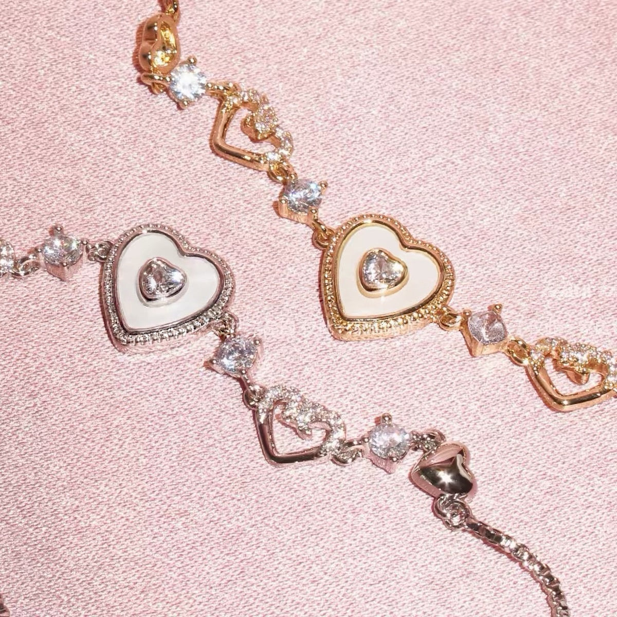 Sweet Holiday Heart Bracelet with gold- and silver-tone metal, heart charms, and sparkling clear crystal accents.
