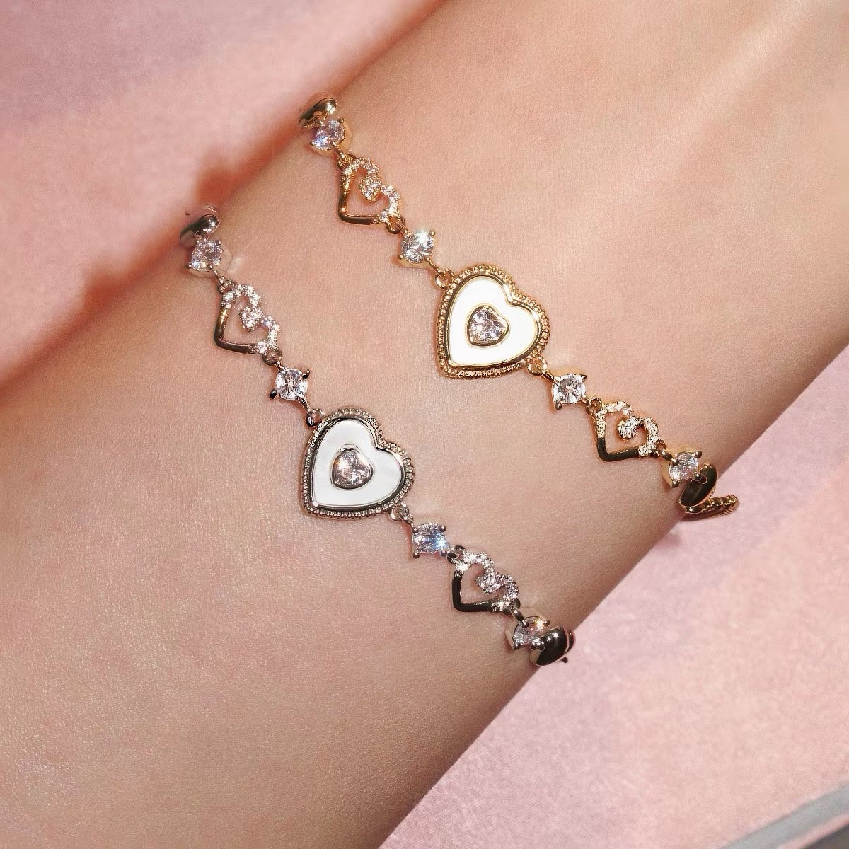 Sweet Holiday Heart Bracelet in gold- and silver-tone metal, with alternating heart charms and sparkling clear stones.